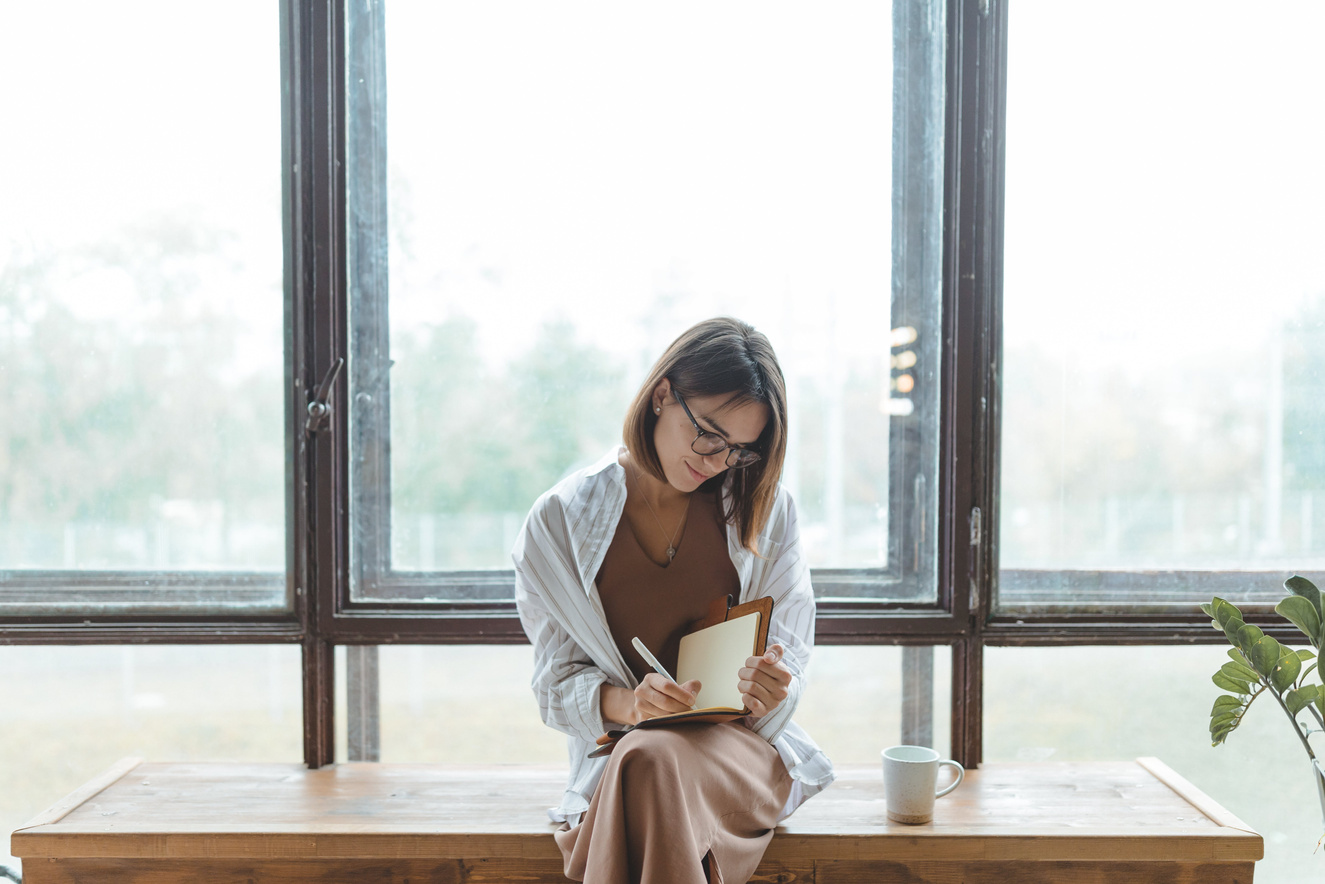 Woman Writing in Journal